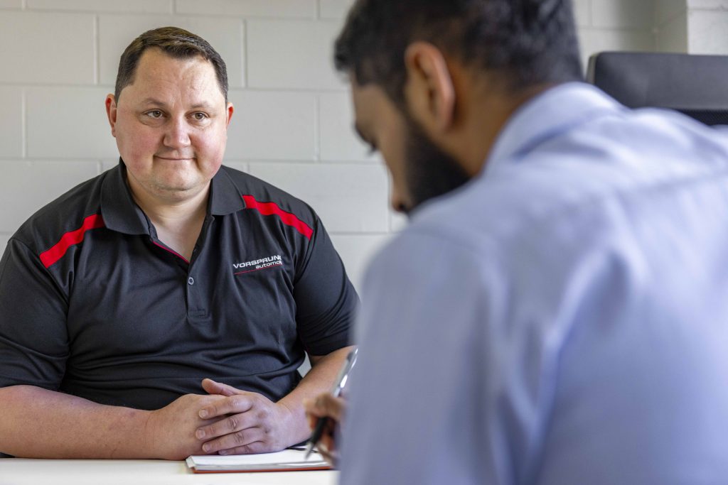 Auckland European car specialist providing honest advice and explaining an itemised service invoice to a customer to ensure there are no surprises.