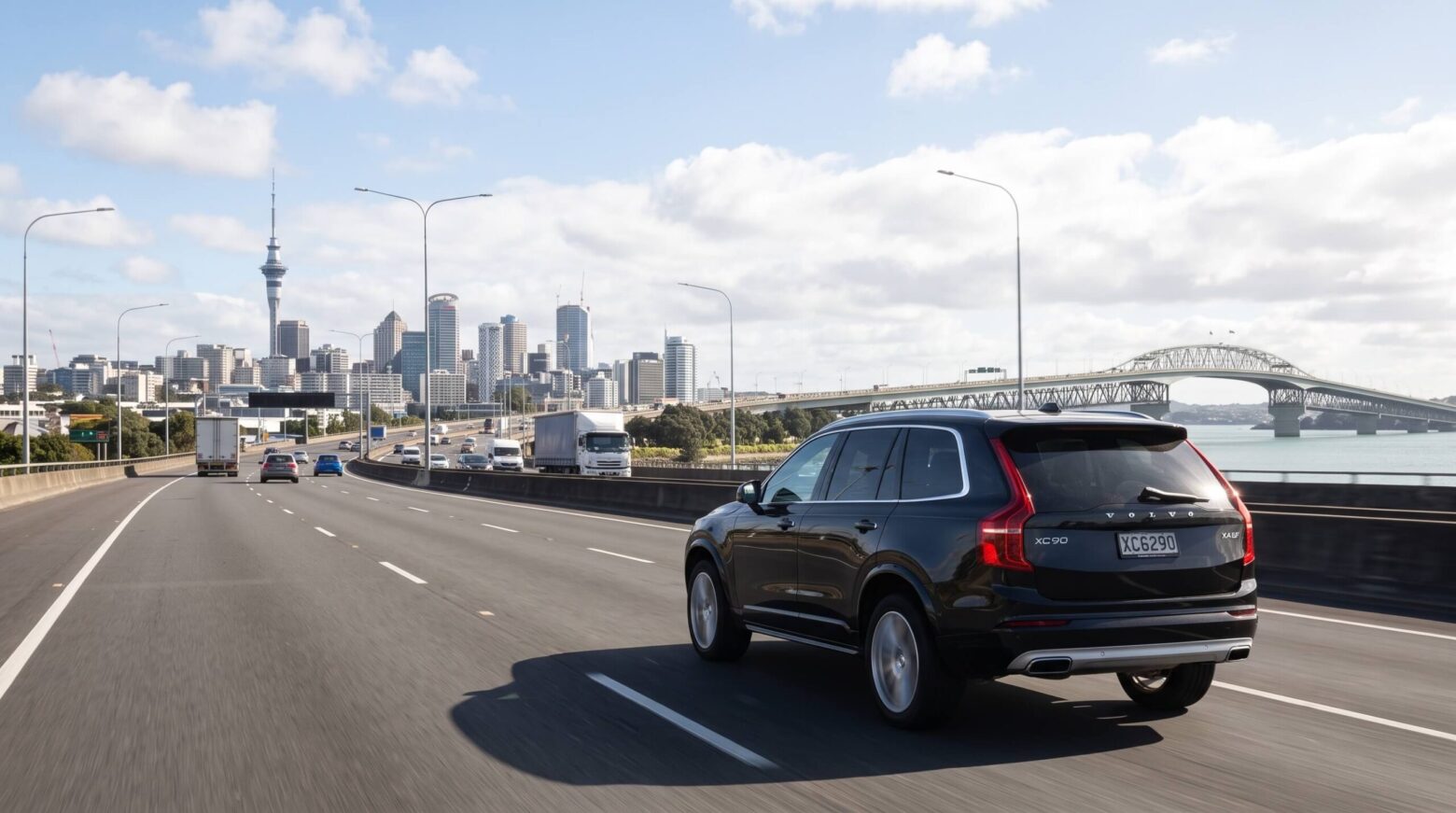 black volvo running on the motor way of Auckland