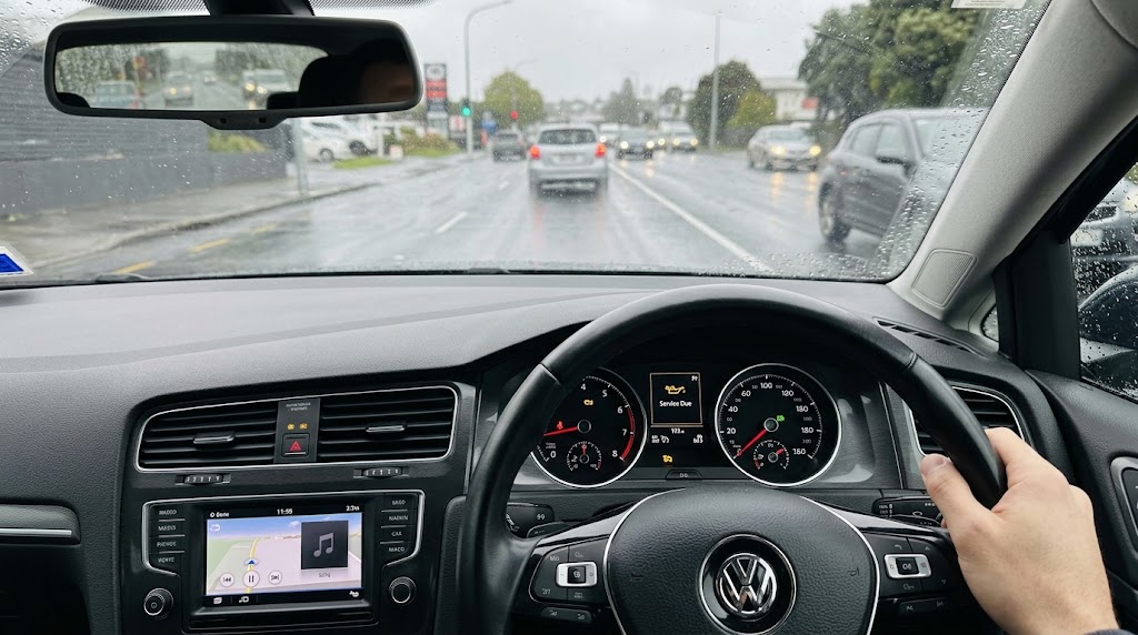 European car dashboard displaying a service reminder warning light, indicating it is time to book an oil change Auckland